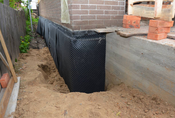 Happy homeowners after waterproofing job in Galena